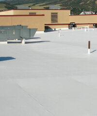 A finished single ply roof coating job.