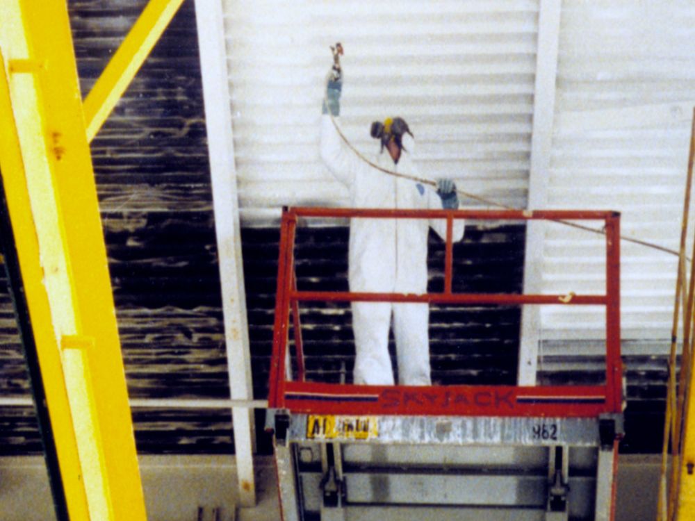 worker painting ceiling 