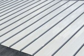 A power-washed roof that is prepped for coating application.