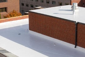 White rubber roof coating on a flat roof