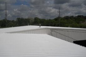 A picture of two warehouses coated with Inland.
